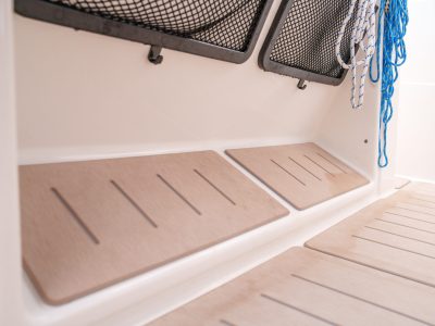 Custom synthetic teak decking installation on a Quicksilver boat
